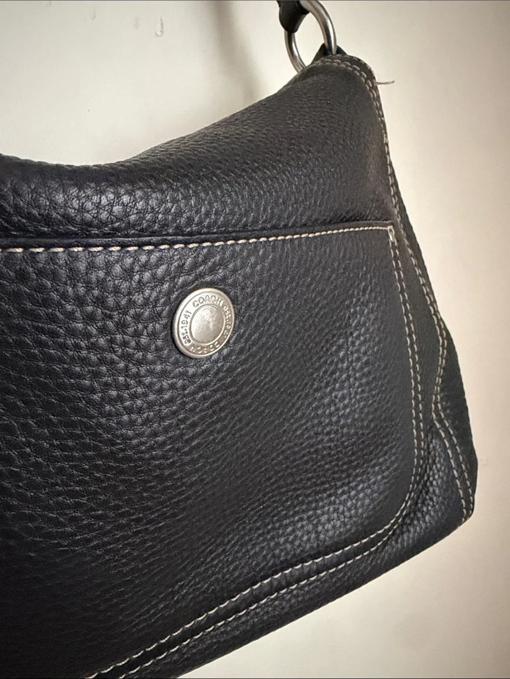 Coach Chelsea hobo shoulder bag crafted from black pebbled leather